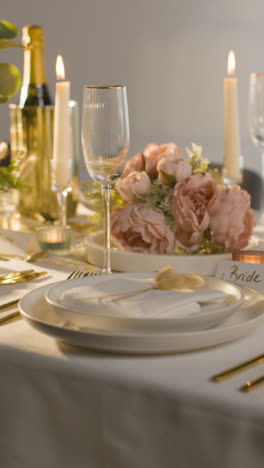 Vertical-Video-Close-Up-Of-Vertical-Video-Of-Table-Set-For-Meal-At-Wedding-Reception-With-Place-Card-For-Bride